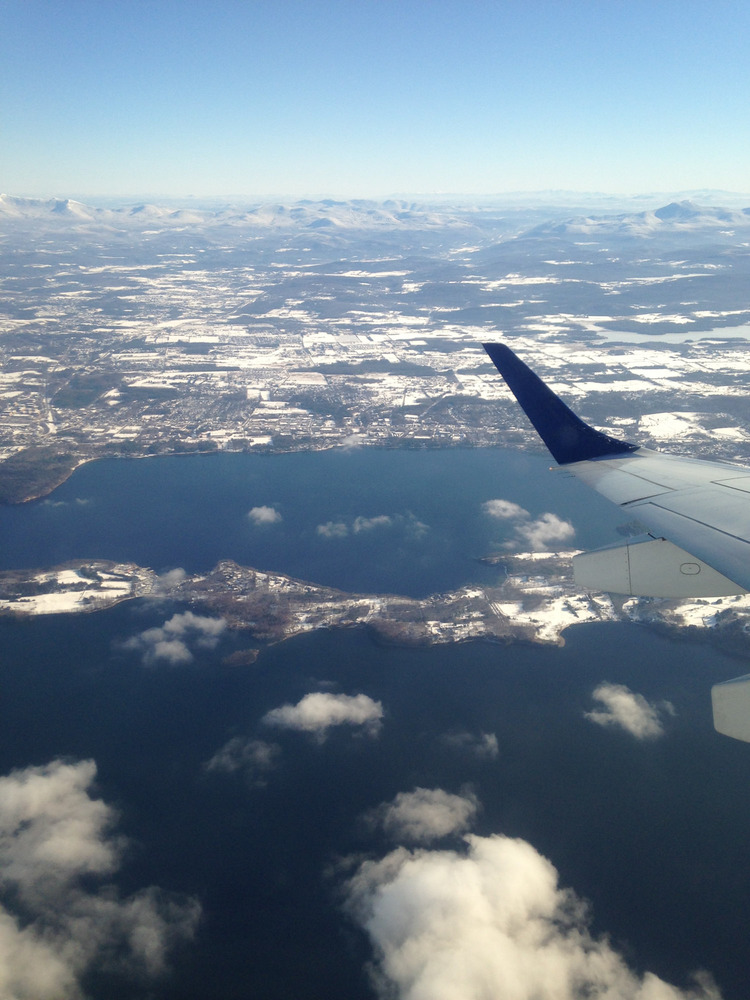 airplane wing tip against the snowy runway